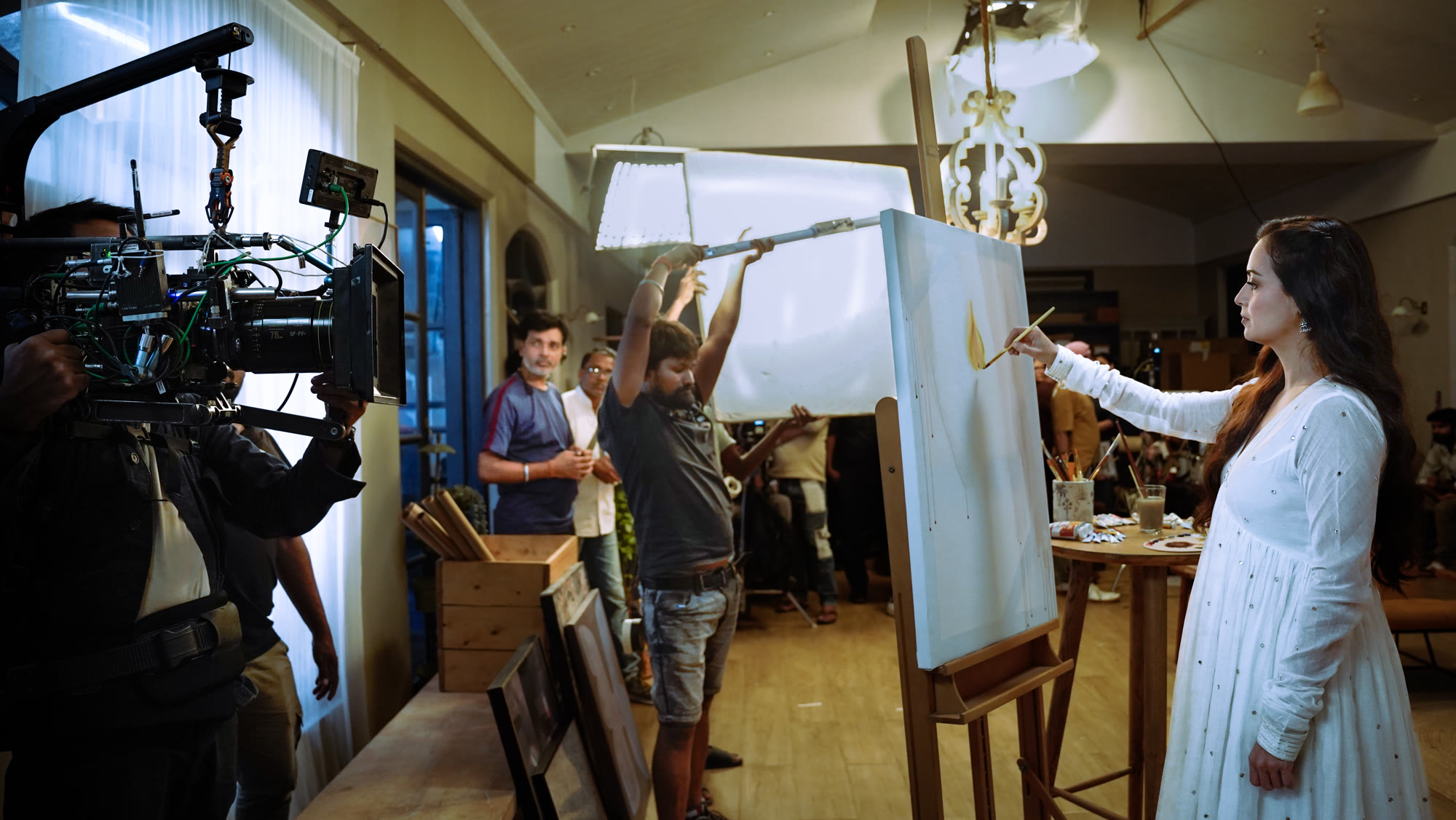 Director and crew reviewing a shot list on set